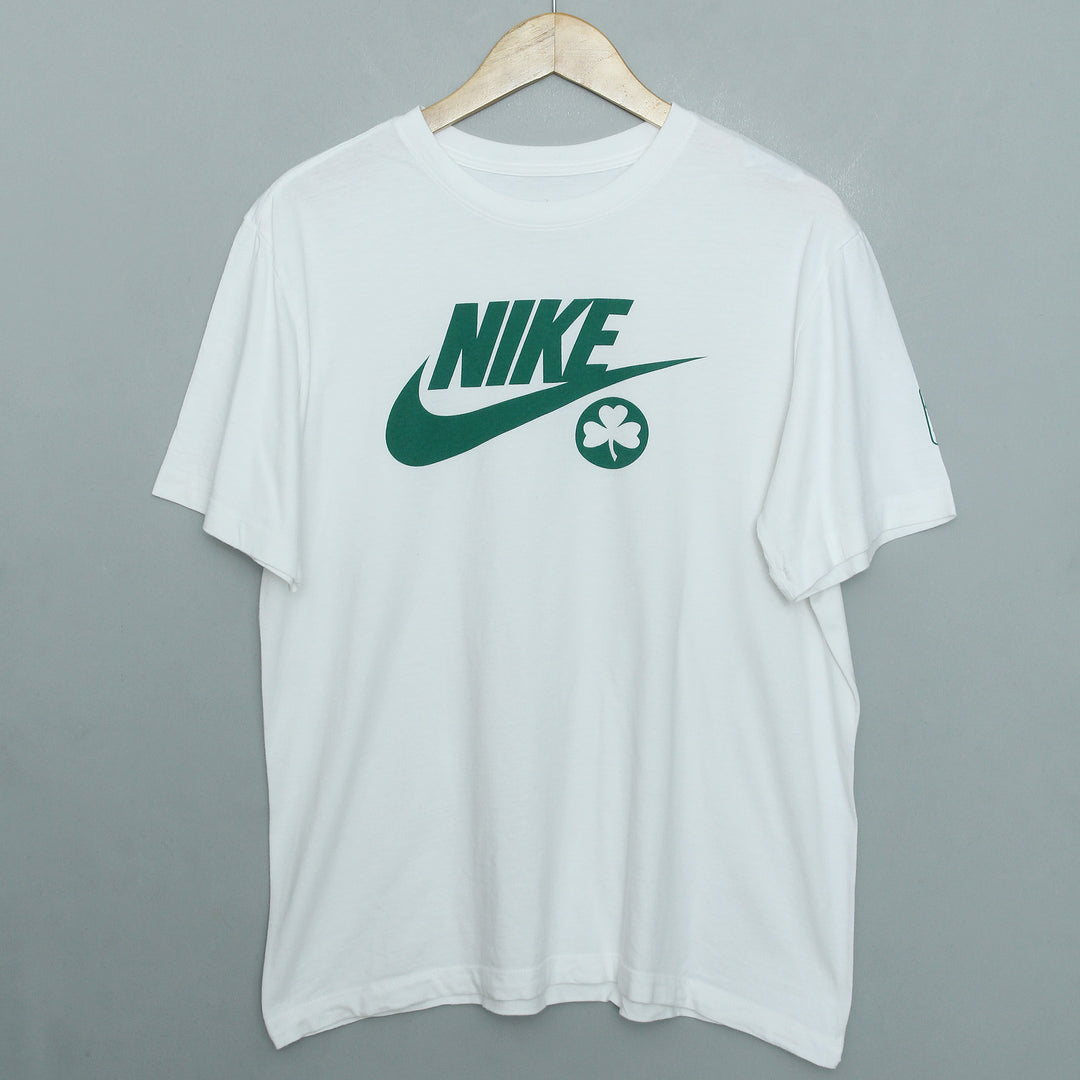 white nike shirt with green swoosh